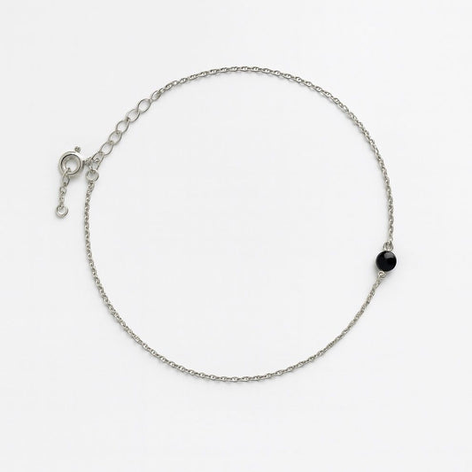 Silver anklet with single black bead