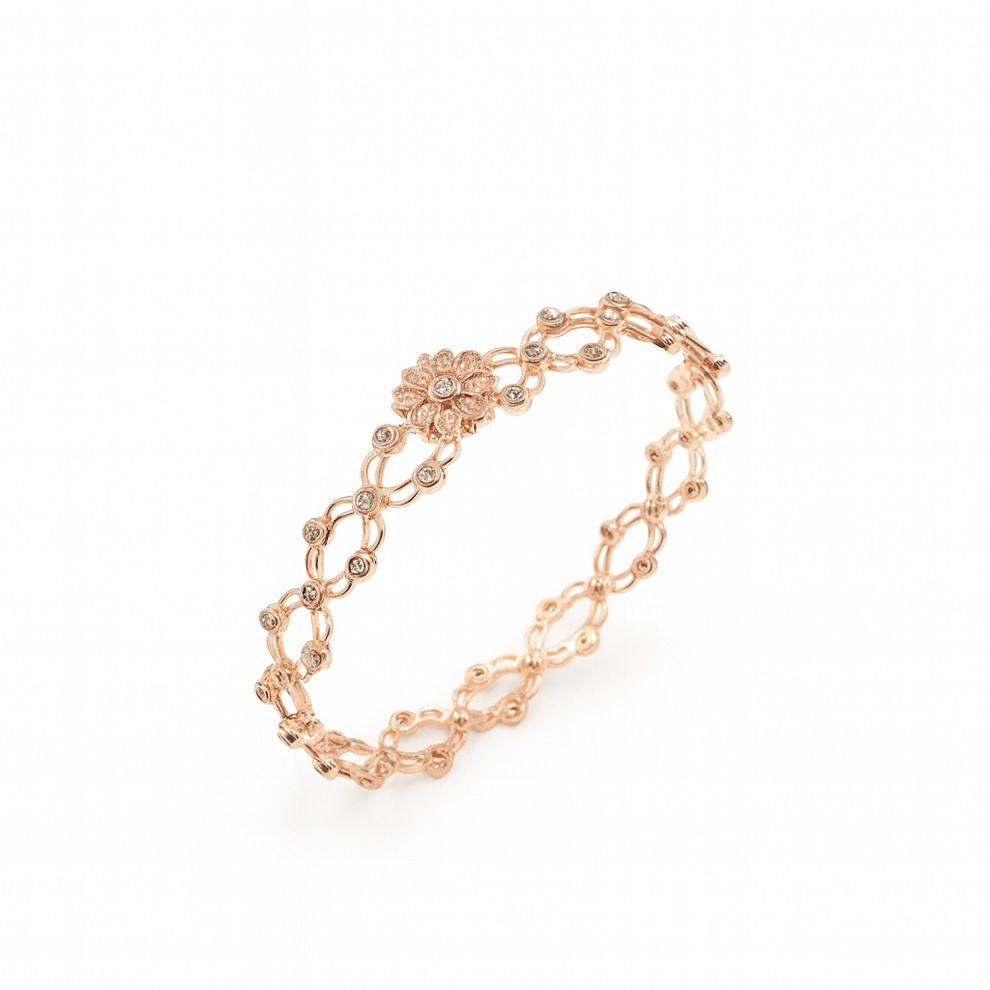 Rose gold bracelet with diamond accents on a white background
