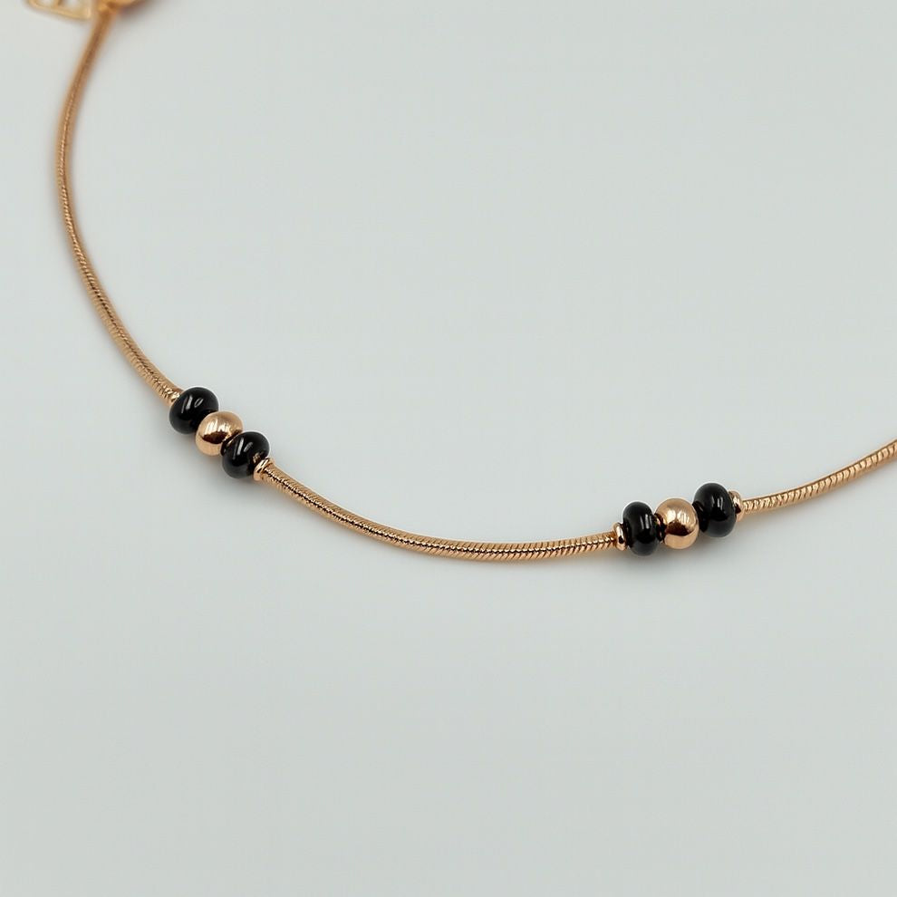 Rose gold silver anklet with black bead accents
