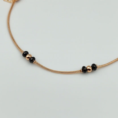 Rose gold silver anklet with black bead accents