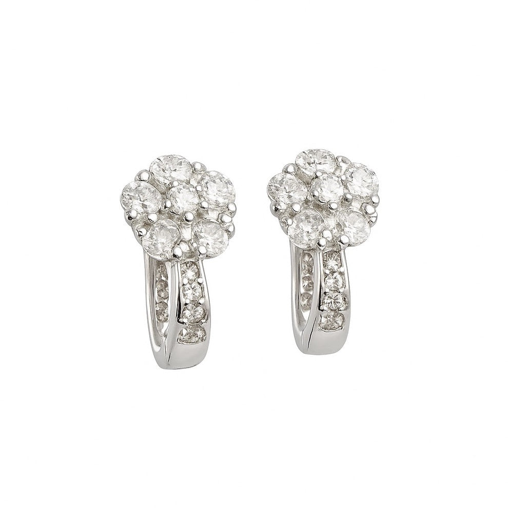 Pair of floral silver earrings on a white background