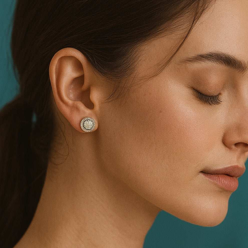 young women wearing a silver earring against a teal background