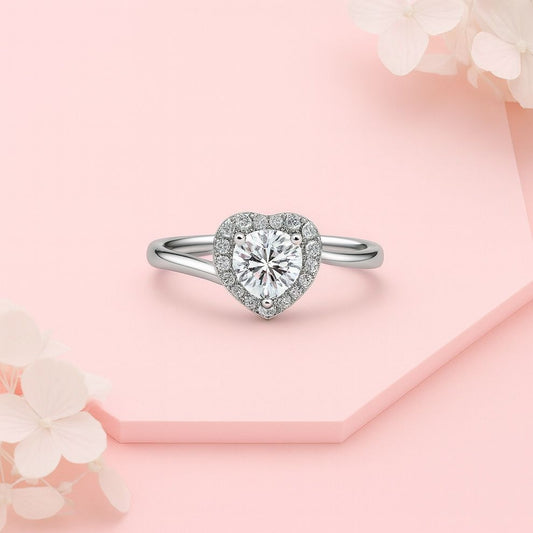 Heart-shaped real silver ring on a pink floral background