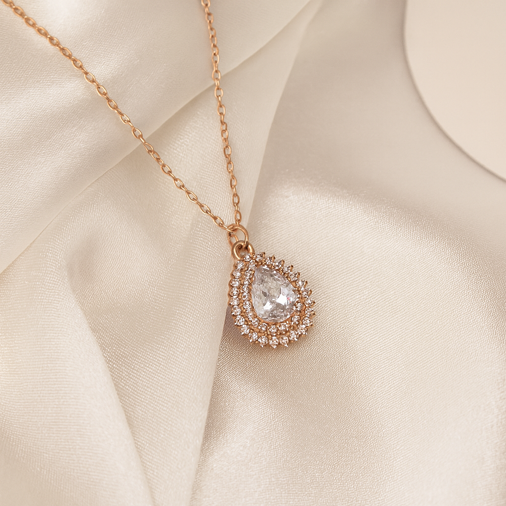 Sparkling Teardrop Halo Pendant in Rose Gold