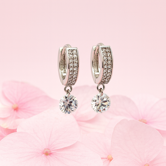 Silver hoop earrings with solitaire drop