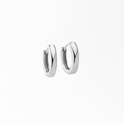 Pair of silver hoop earrings on a white background