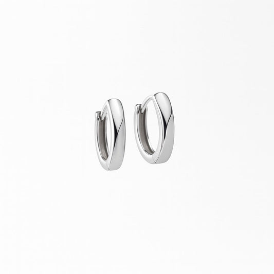 Pair of silver hoop earrings on a white background