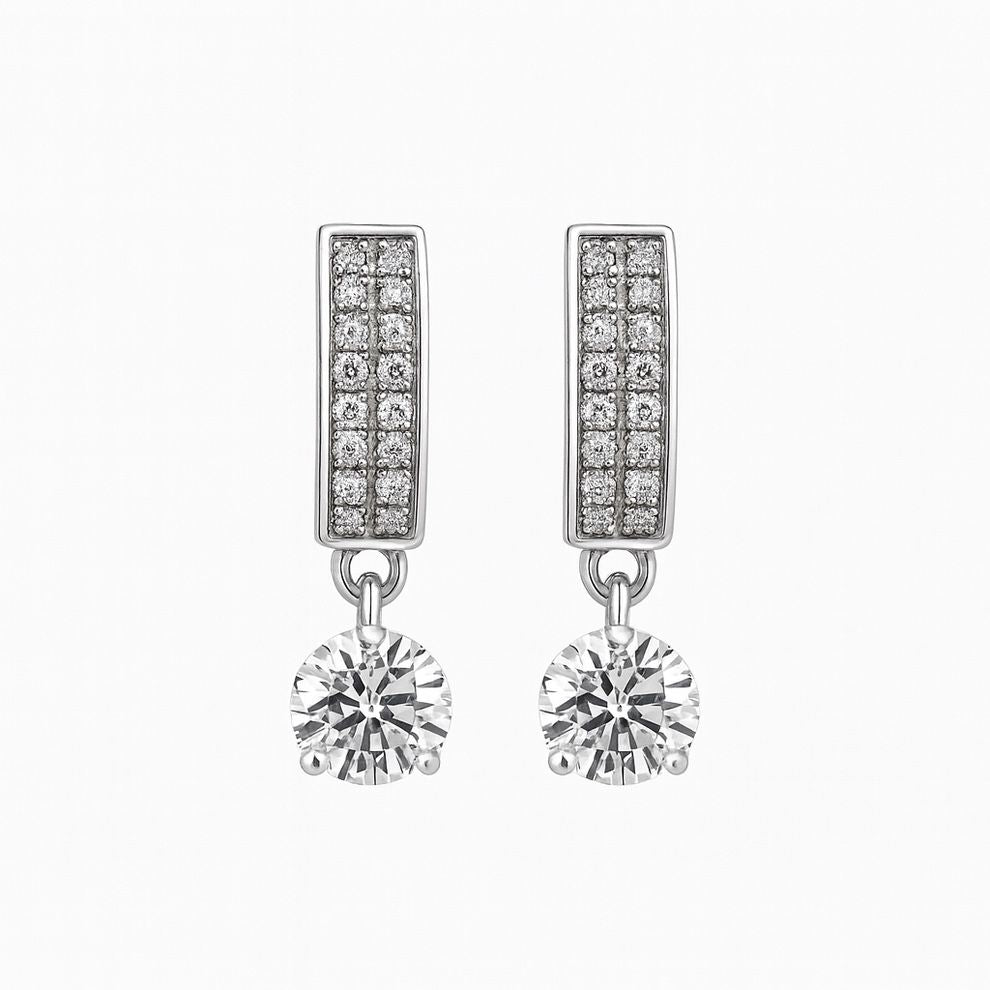 Silver earrings with diamond accents on a white background