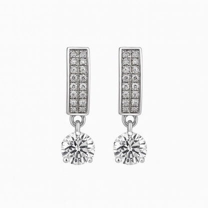 Silver earrings with diamond accents on a white background