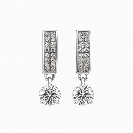 Silver earrings with diamond accents on a white background
