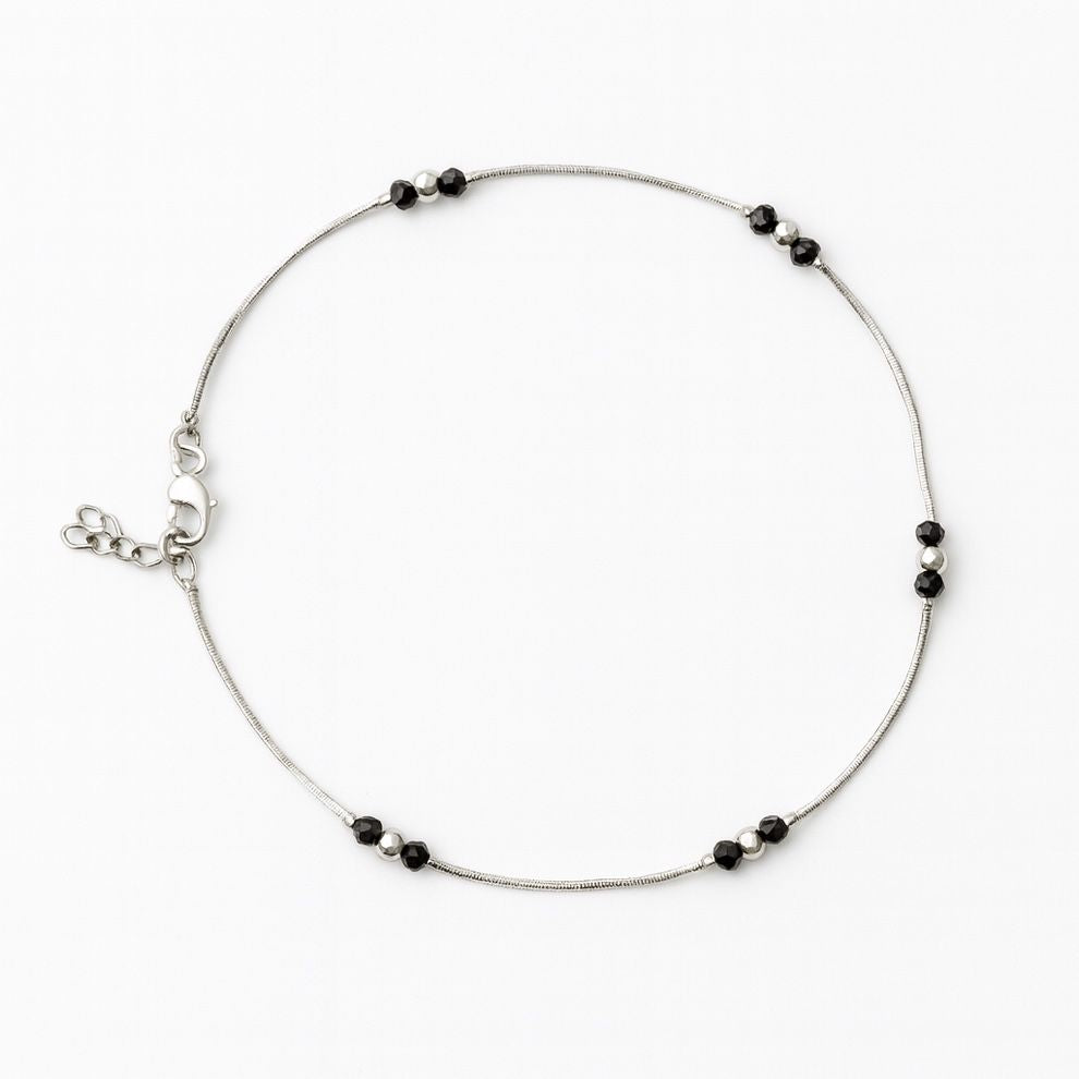 Silver anklet with black bead accents