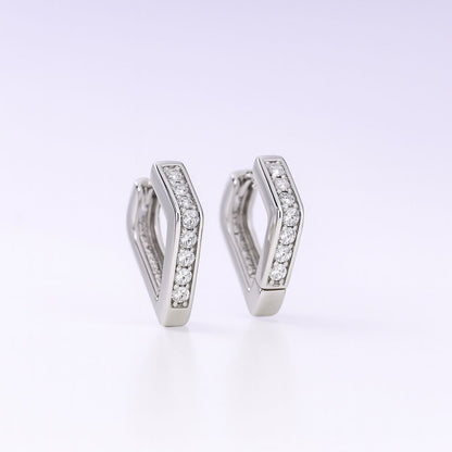 Pair of silver hoop earrings with embedded stones on a white background