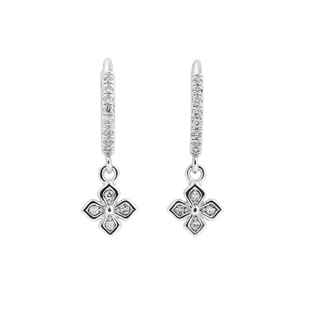 Silver earrings with diamond accents on a white background