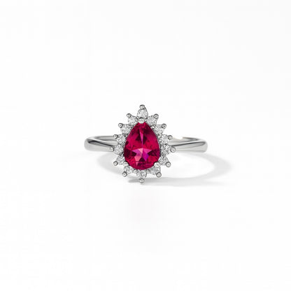 Silver ring with a pink gemstone on a white background