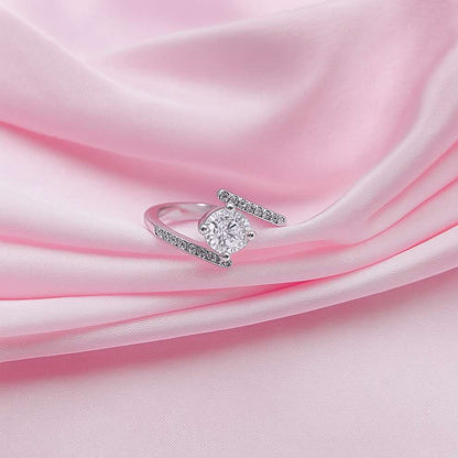 Silver ring with a diamond look on pink fabric