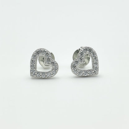 Heart-shaped silver earrings with clear stones on a white background