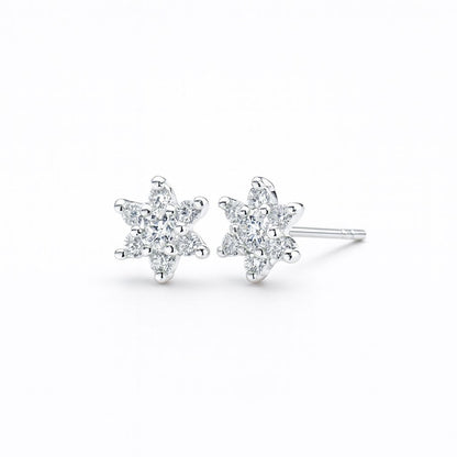 Star-shaped earrings with clear stones on a white background
