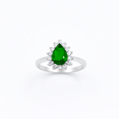 silver ring with a green gemstone on a white background