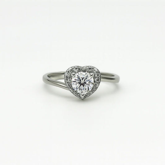 Heart-shaped silver ring on a white background