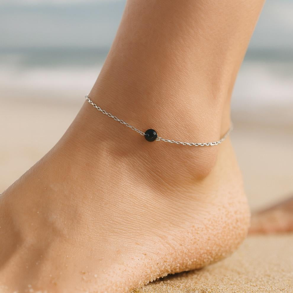Silver anklet with single black bead